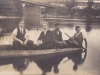 plavba na drevenej lodi pod mostom v Púchove v r. 1936 (Laco Pribiš, Karol Demáček, Berto Kemény a neznámy džentlmen)